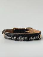 cat wearing black woven leather collar with obsidian gemstone chain