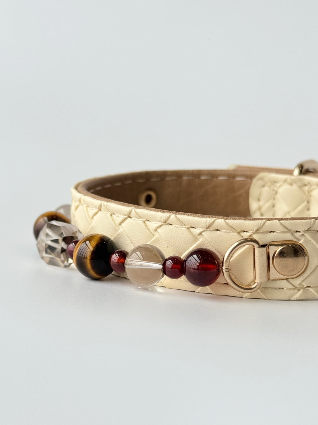 premium cream woven leather pet collar with tiger eye crystal chain lifestyle photo