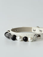 premium white leather pet collar with rutilated crystal leaf and pearl chain lifestyle photo