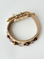 cat wearing cream woven leather collar with tiger eye crystal chain