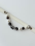 cat wearing white leather collar with pearl and rutilated crystal chain