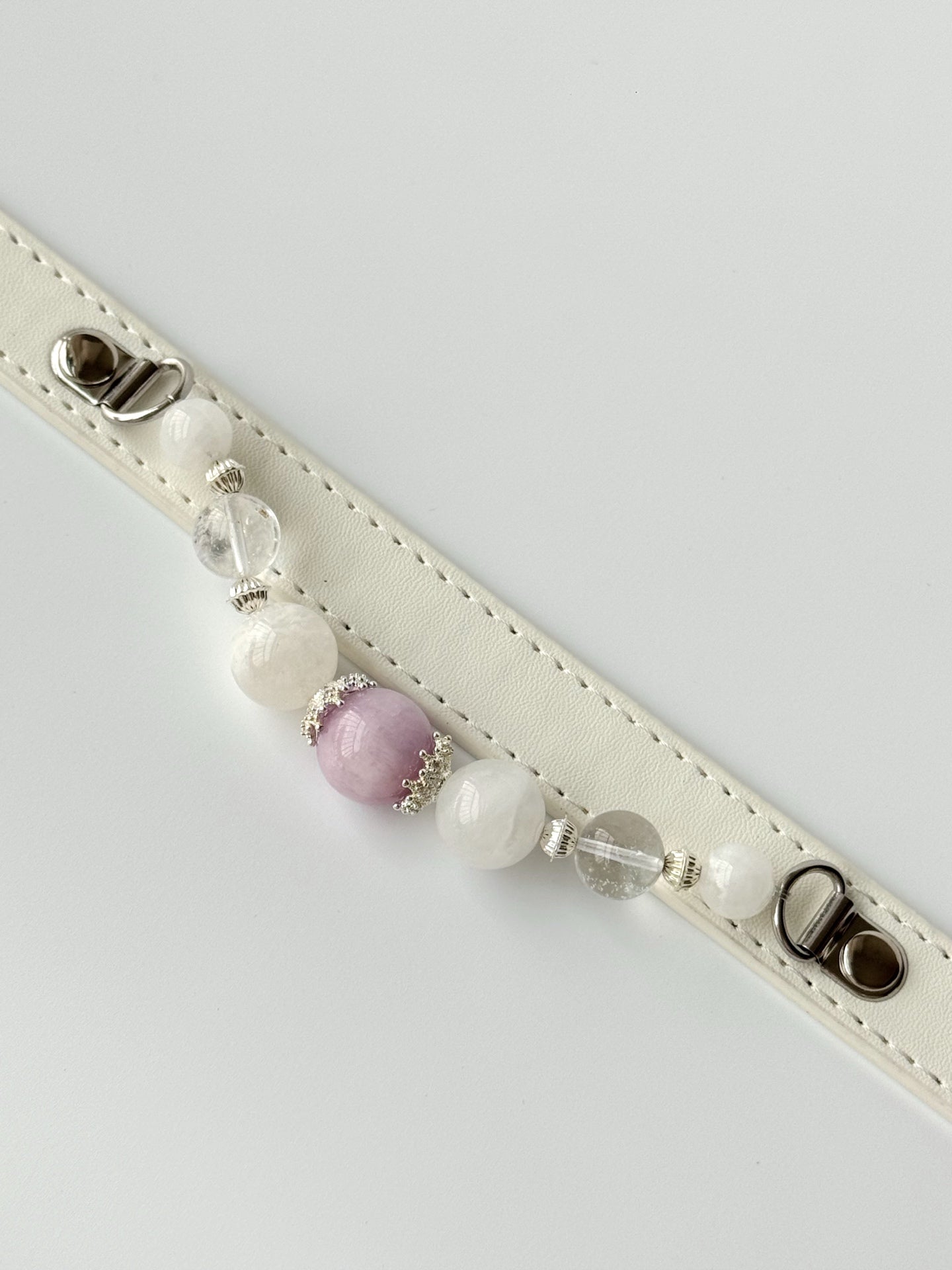 cat wearing crystal gemstone bead collar with pink jade and quartz